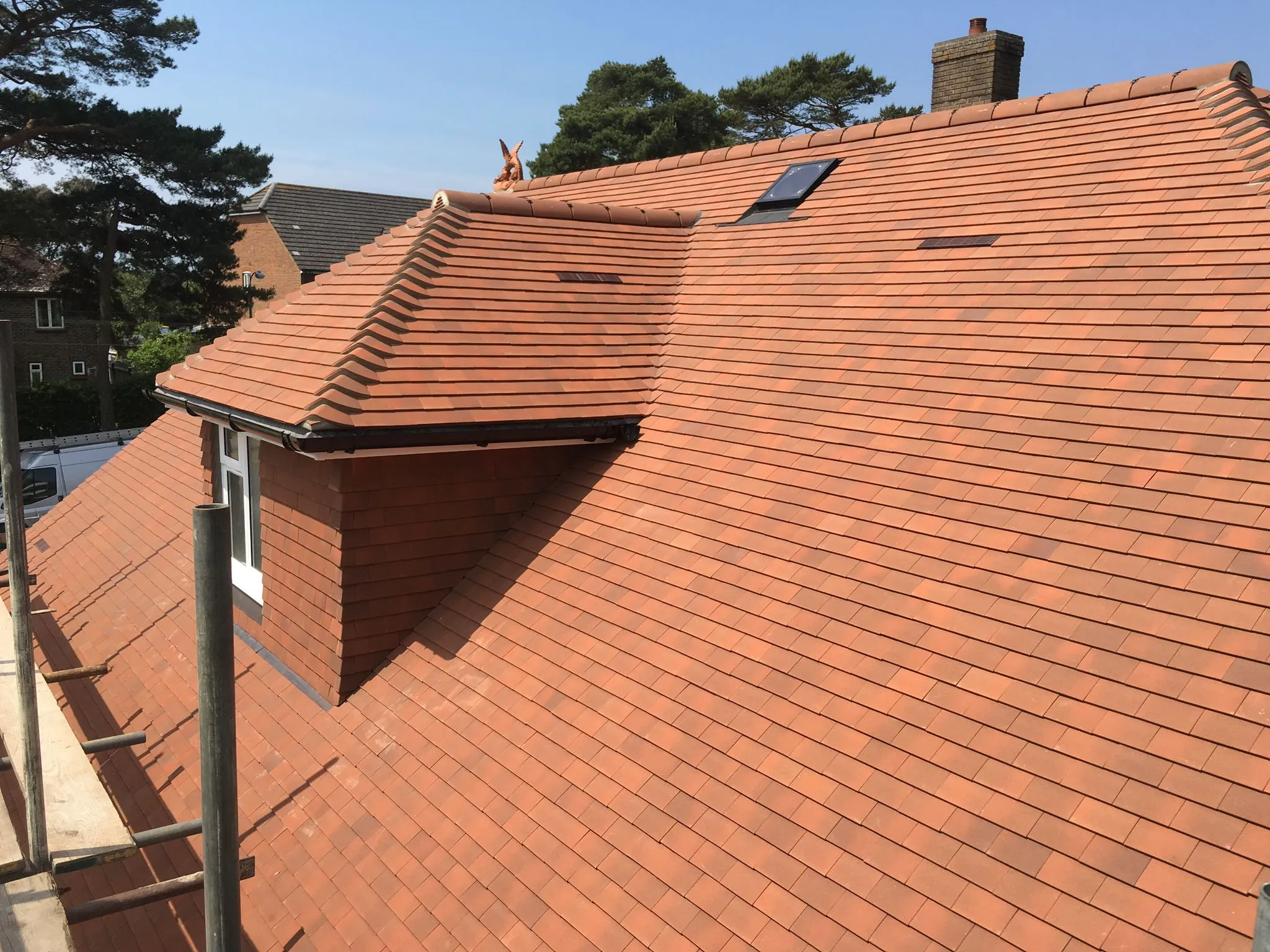 a red roof with a small window on top of it